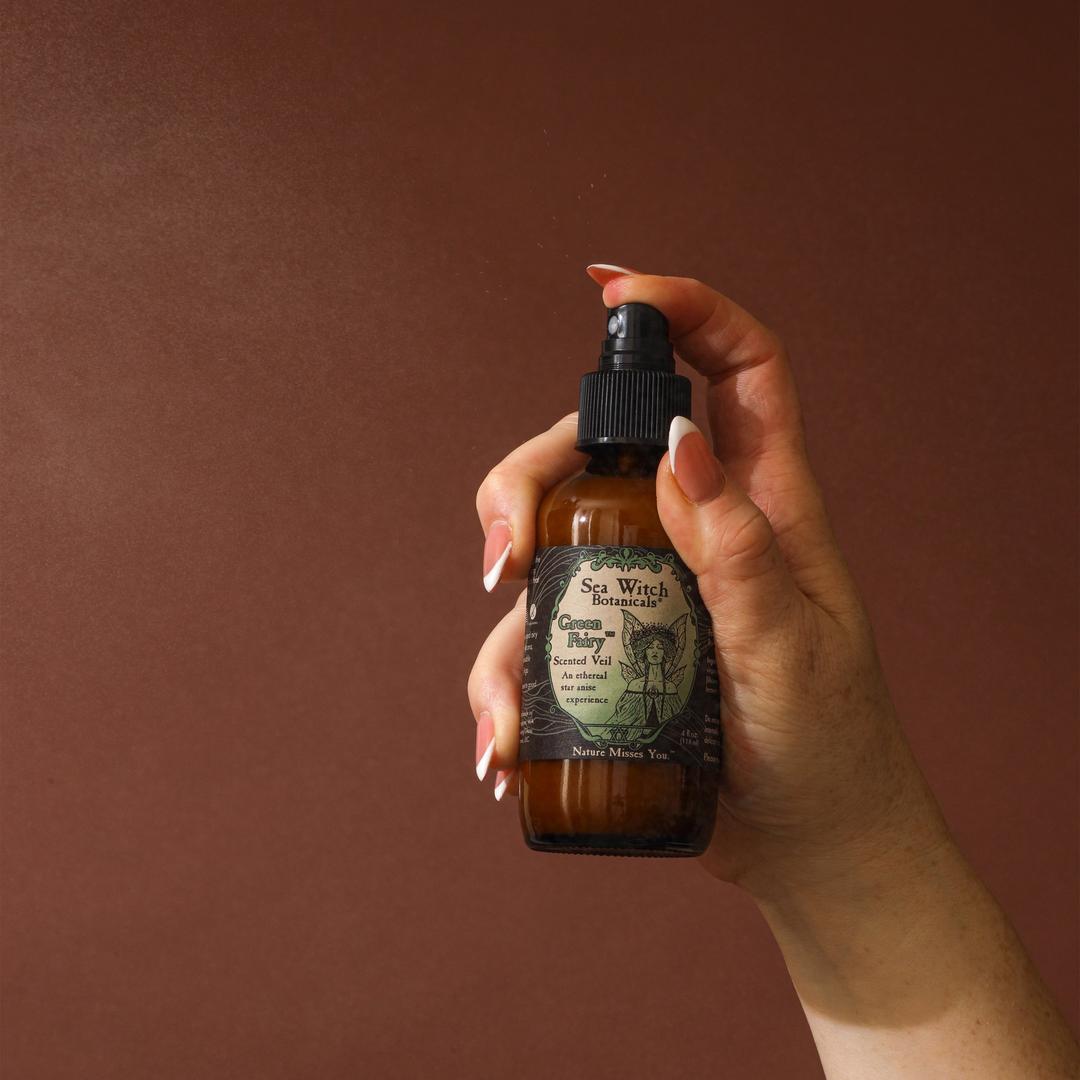 Hand holding a bottle of &